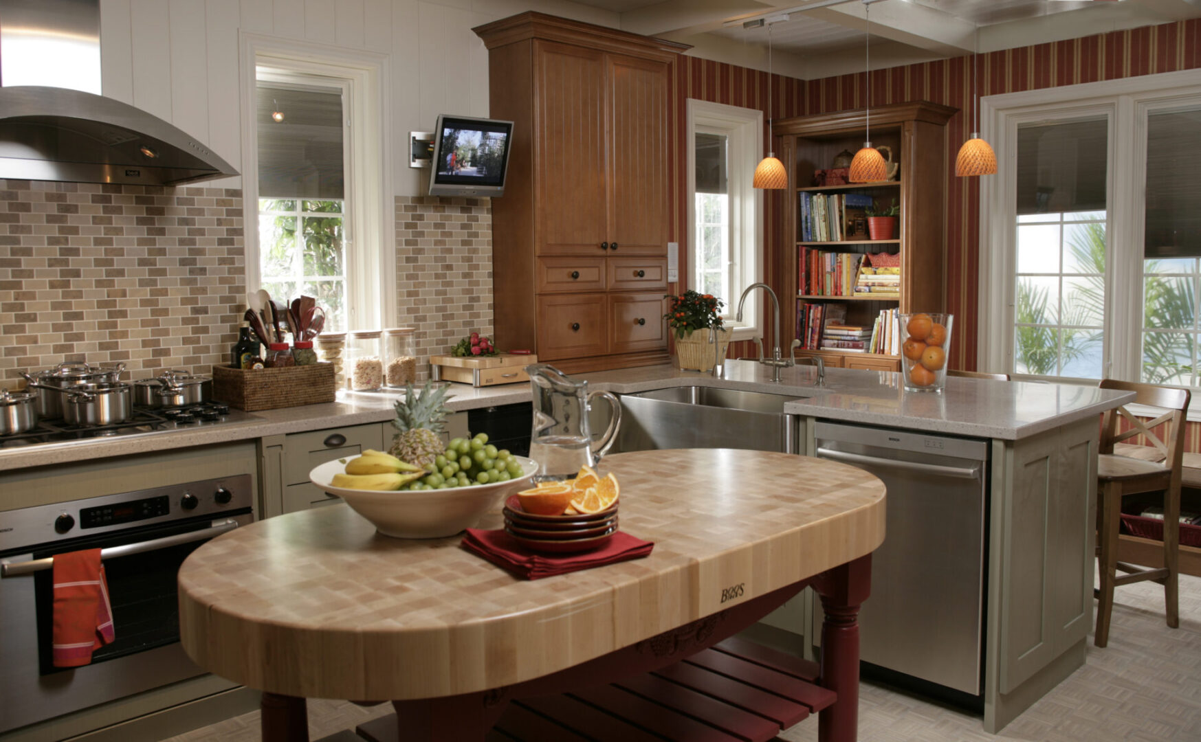 A kitchen with a table full of fruits