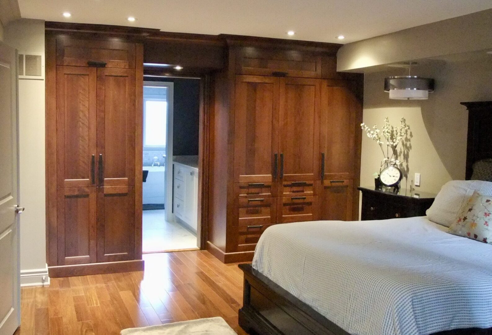 Main bedroom with custom armoire units