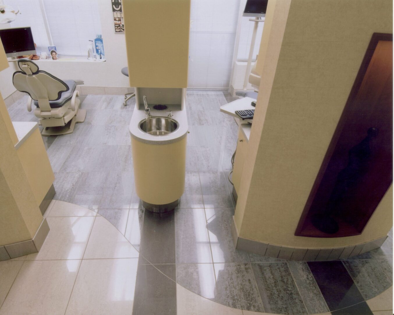 Dental office operator area with seats and basins