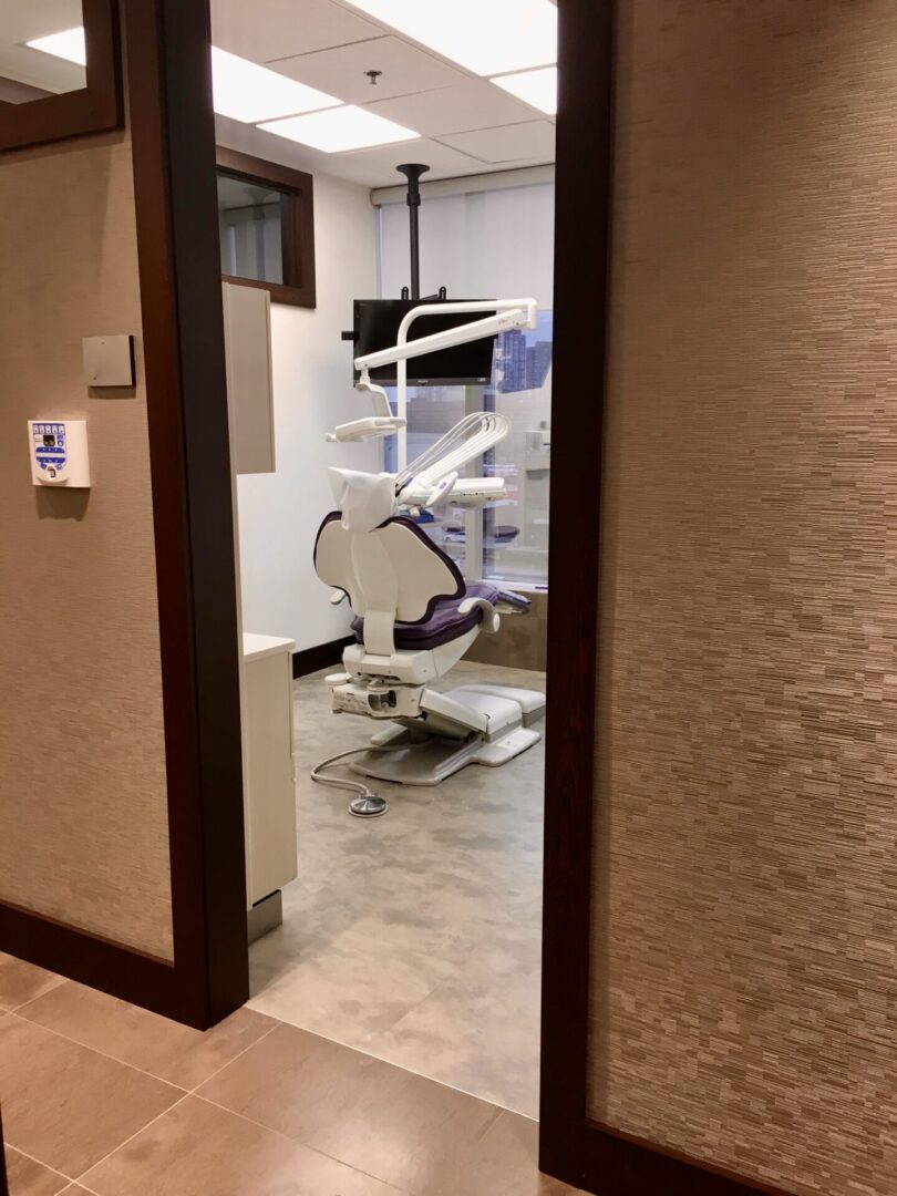 view of a dental office room with a chair