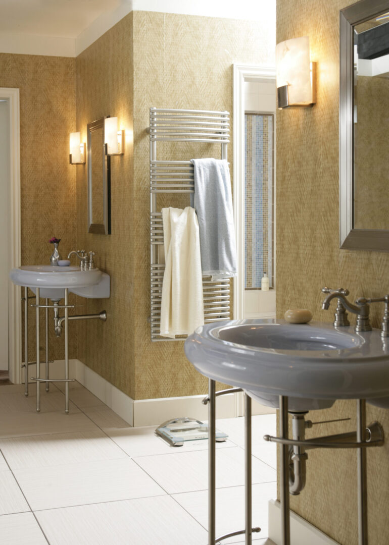 A bathroom with basin and towels