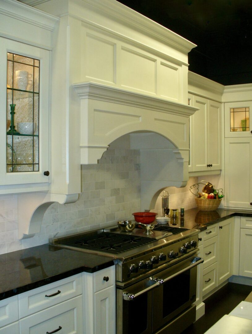 A beautifully designed kitchen with a gas stove.