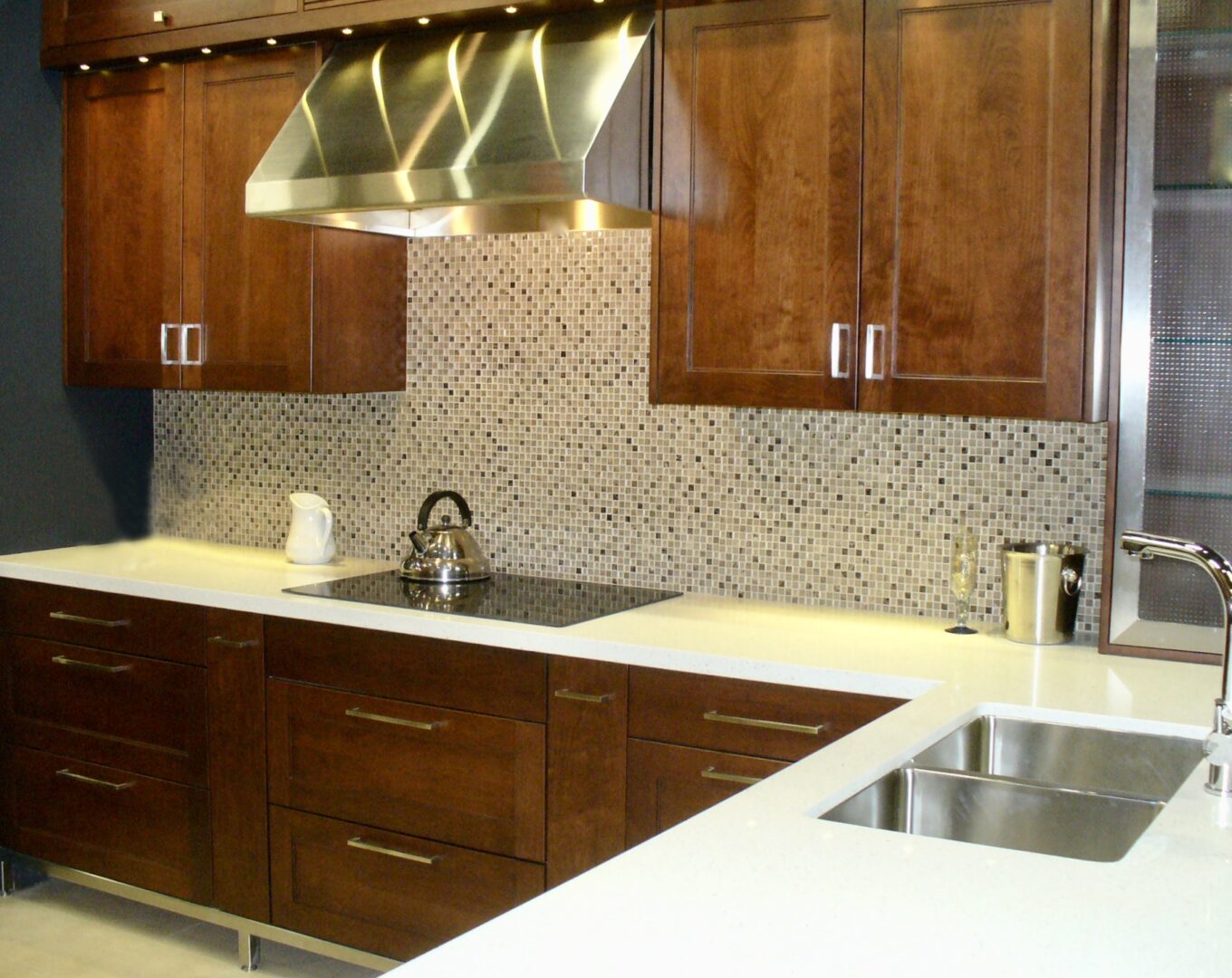 A customized kitchen with chimney and basin
